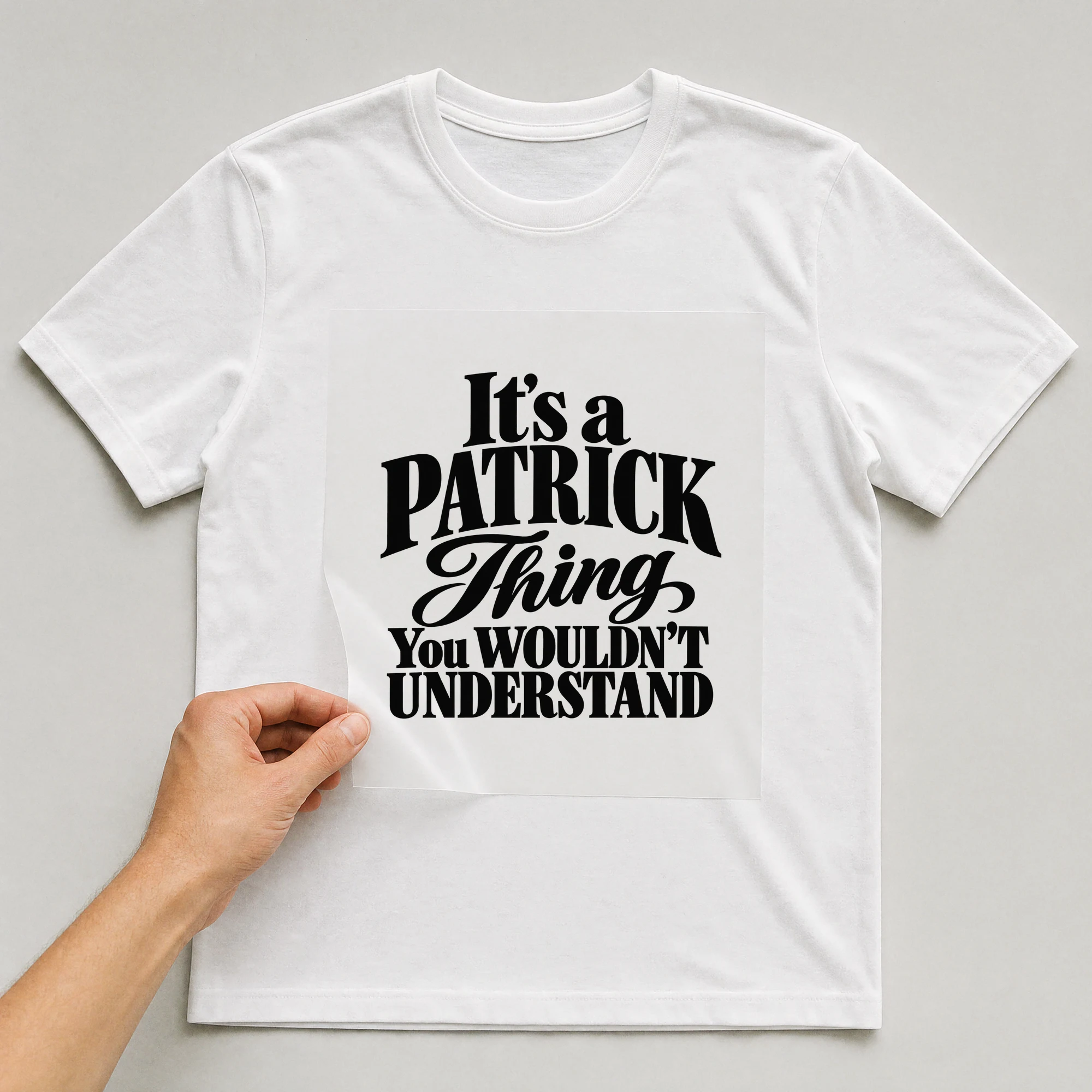 Bügelbild „It's a PATRICK Thing You WOULDN'T UNDERSTAND“ auf weißem T-Shirt, Folie wird aufgelegt
