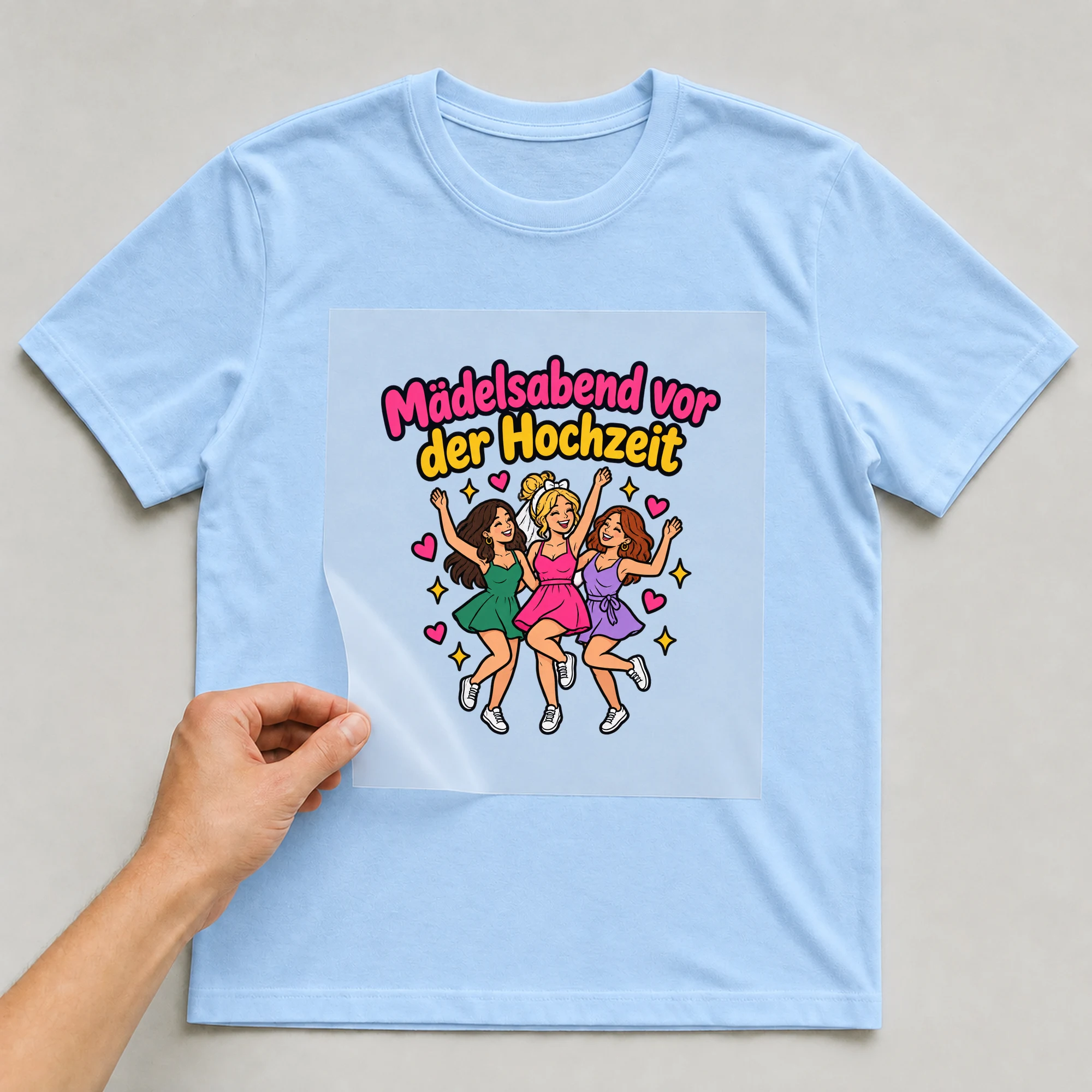 Bügelbild „Mädelsabend vor der Hochzeit“ auf babyblauem T-Shirt, Folie wird aufgelegt
