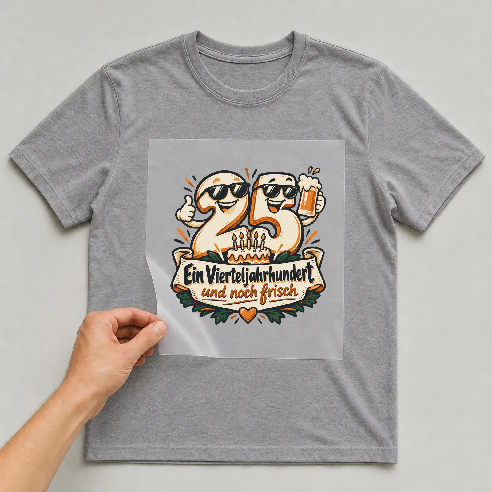 Bügelbild 25: Ein Vierteljahrhundert und noch frisch auf grauem T-Shirt, Folie wird aufgelegt