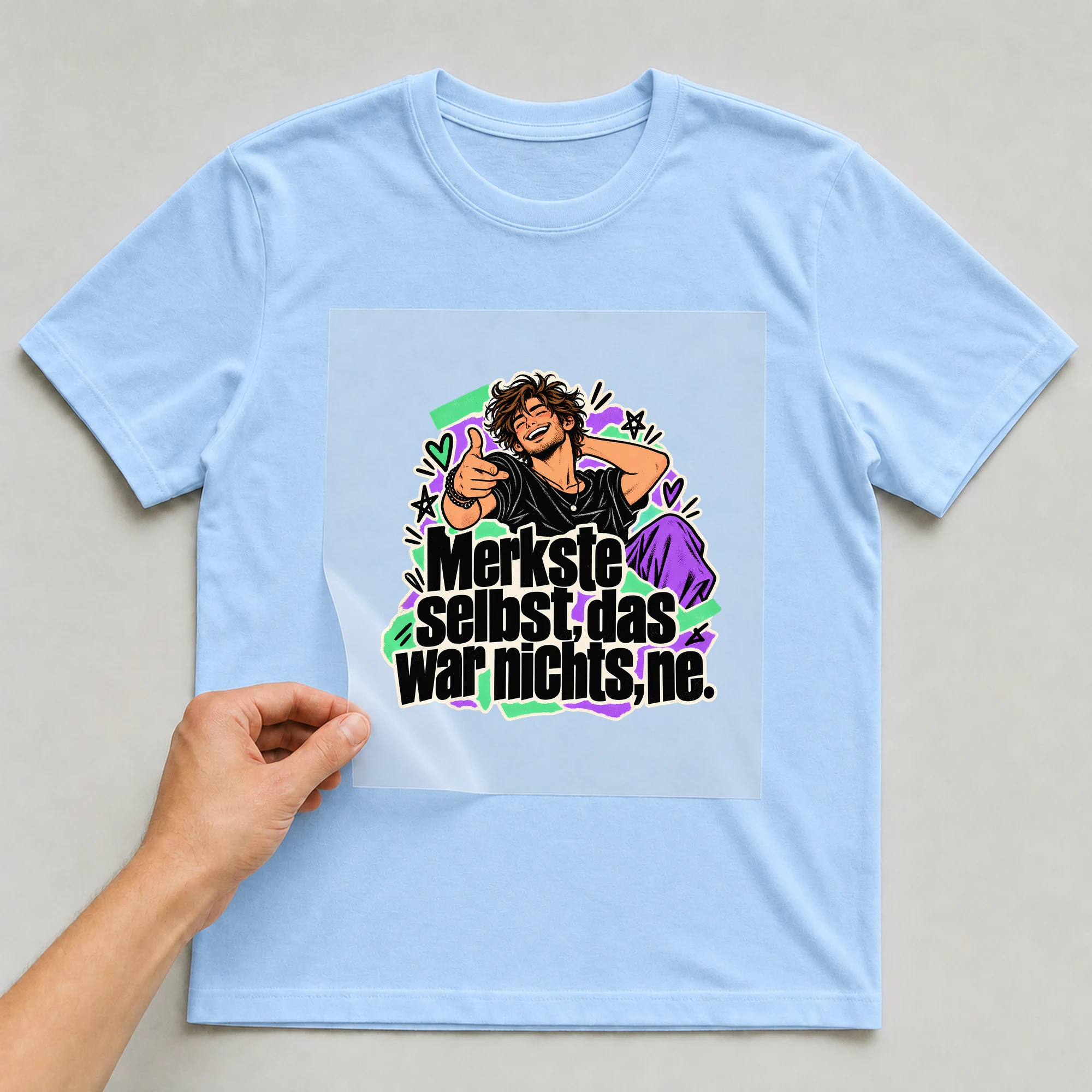 Bügelbild „Merkste selbst, das war nichts, ne.“ auf babyblauem T-Shirt, Folie wird aufgelegt