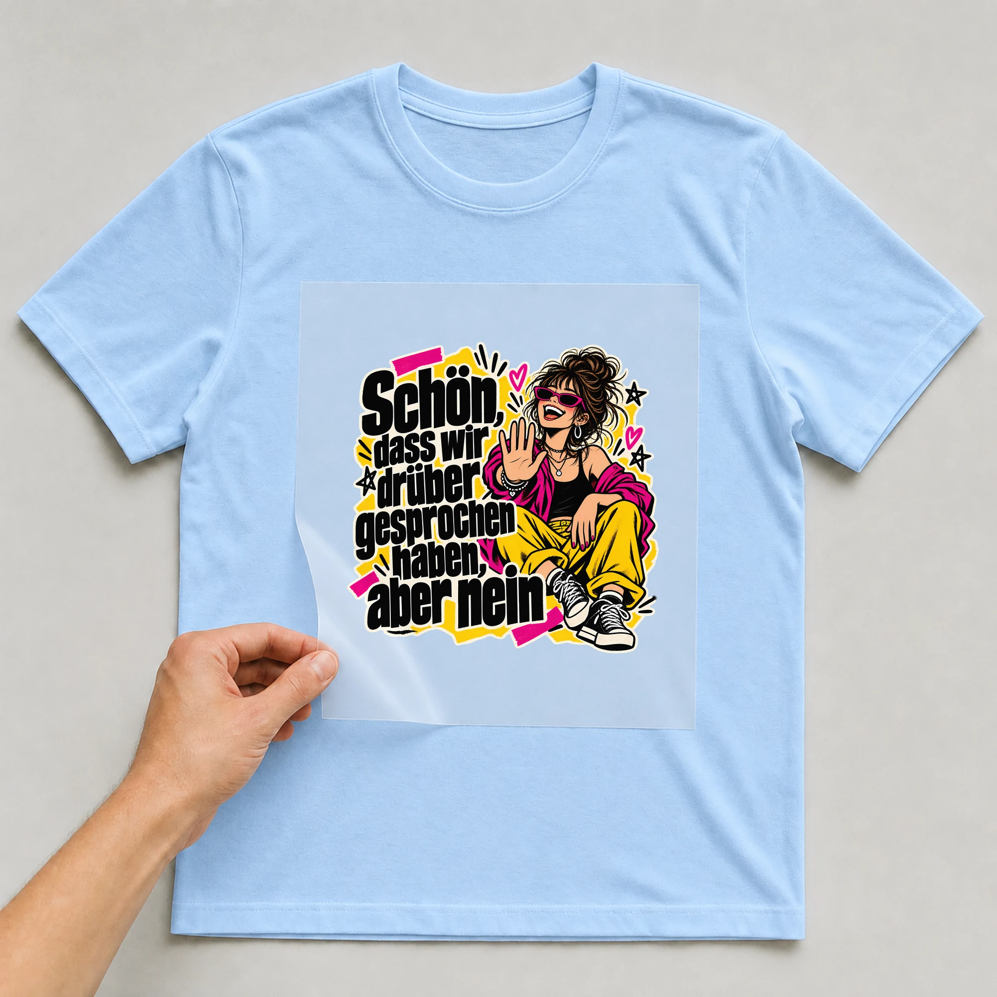 Bügelbild „Schön, dass wir drüber gesprochen haben, aber nein“ auf babyblauem T-Shirt, Folie wird aufgelegt