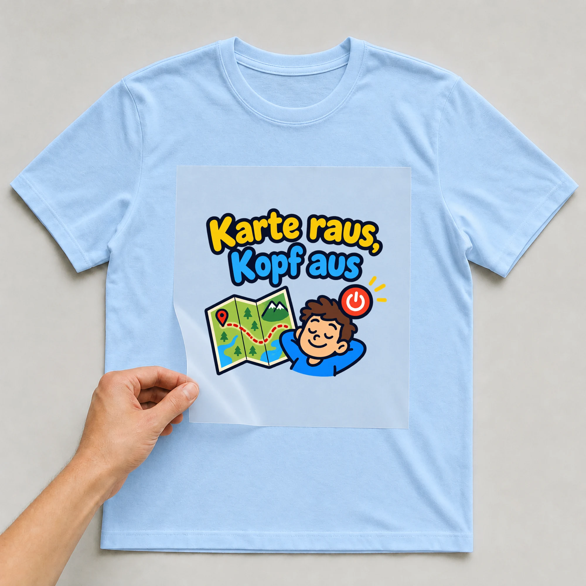 Bügelbild „Karte raus, Kopf aus“ auf babyblauem T-Shirt, Folie wird aufgelegt