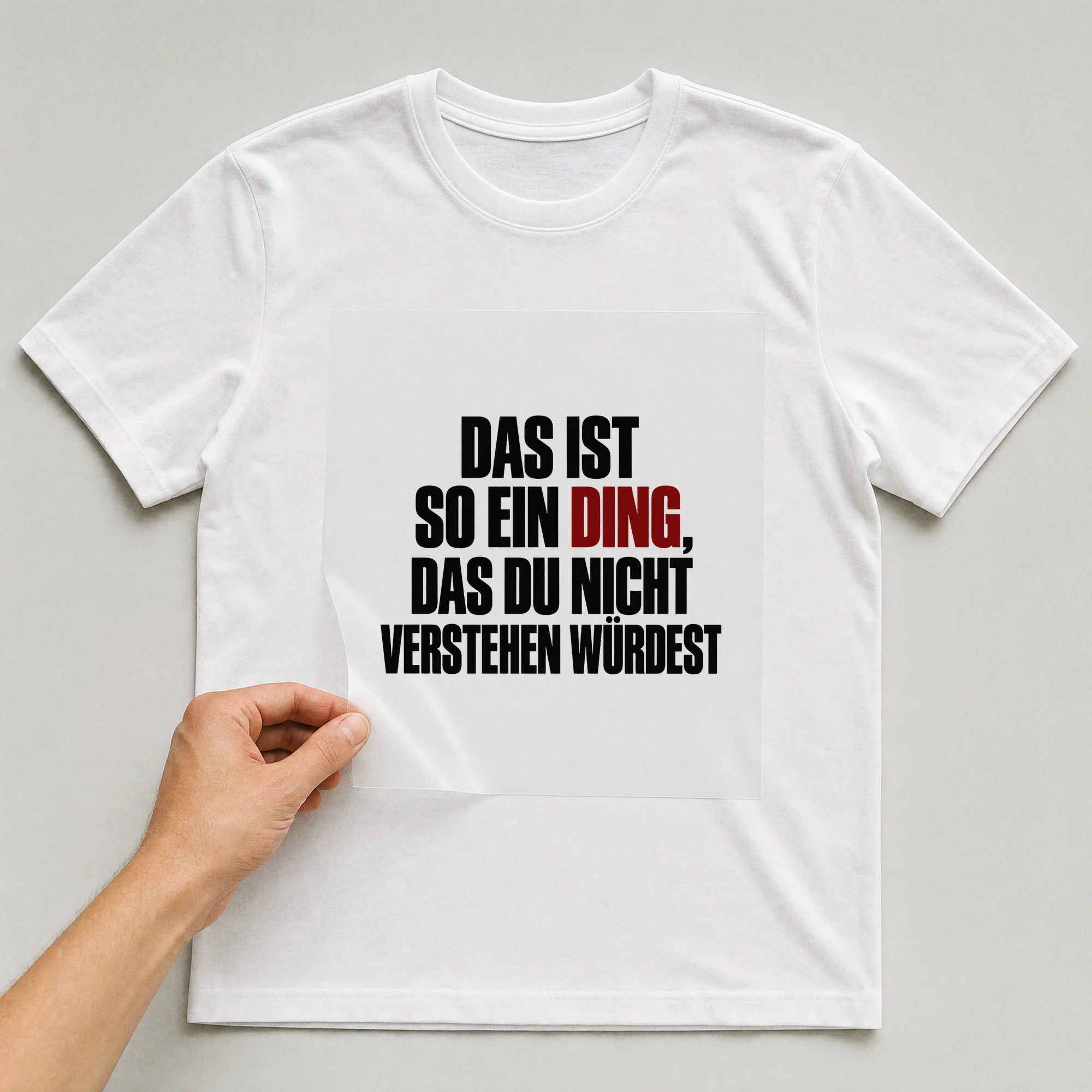 Bügelbild „Das ist so ein Ding, das du nicht verstehen würdest“ auf weißem T-Shirt, Folie wird aufgelegt