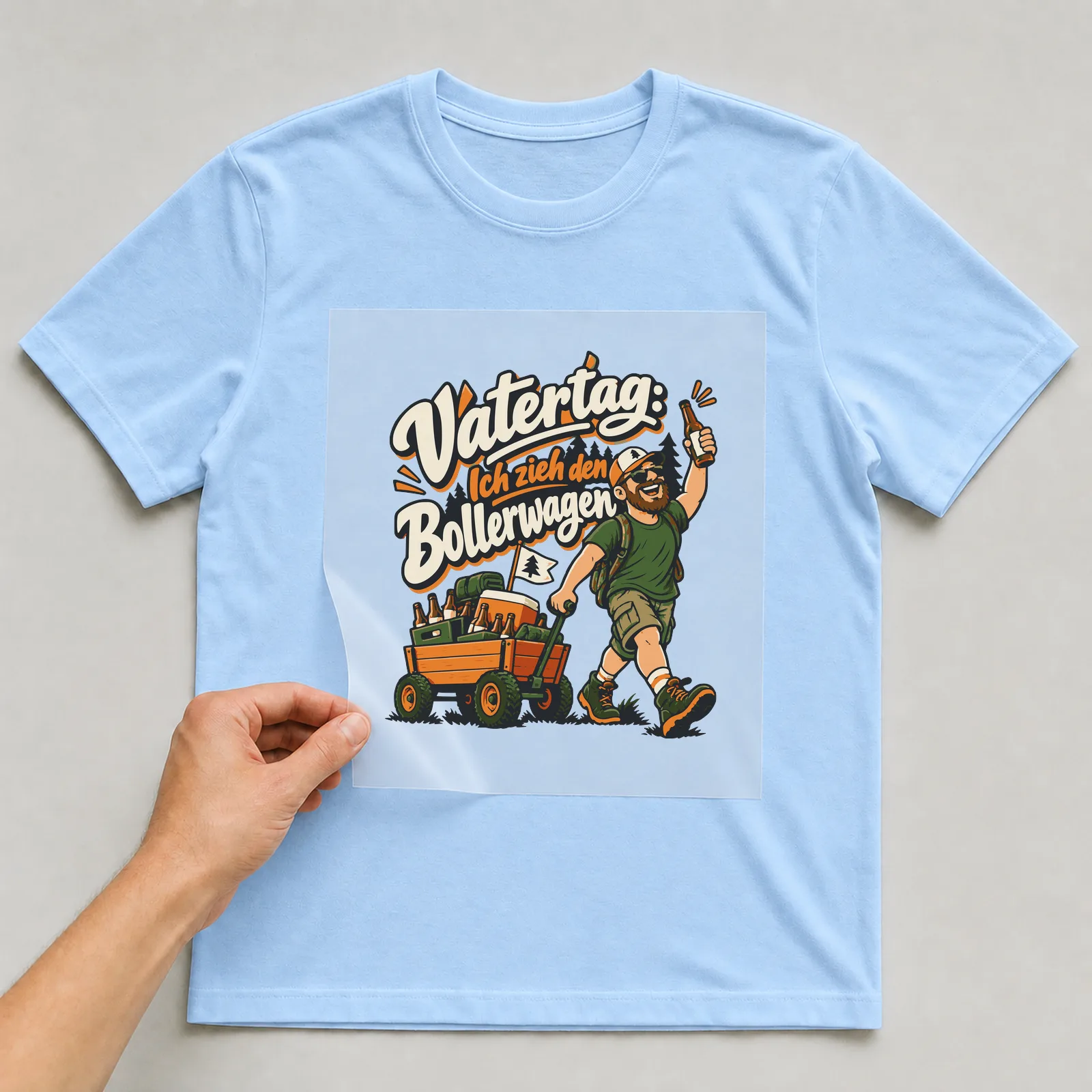 Bügelbild Vatertag: Ich zieh den Bollerwagen auf hellblauem T-Shirt, Folie wird aufgelegt