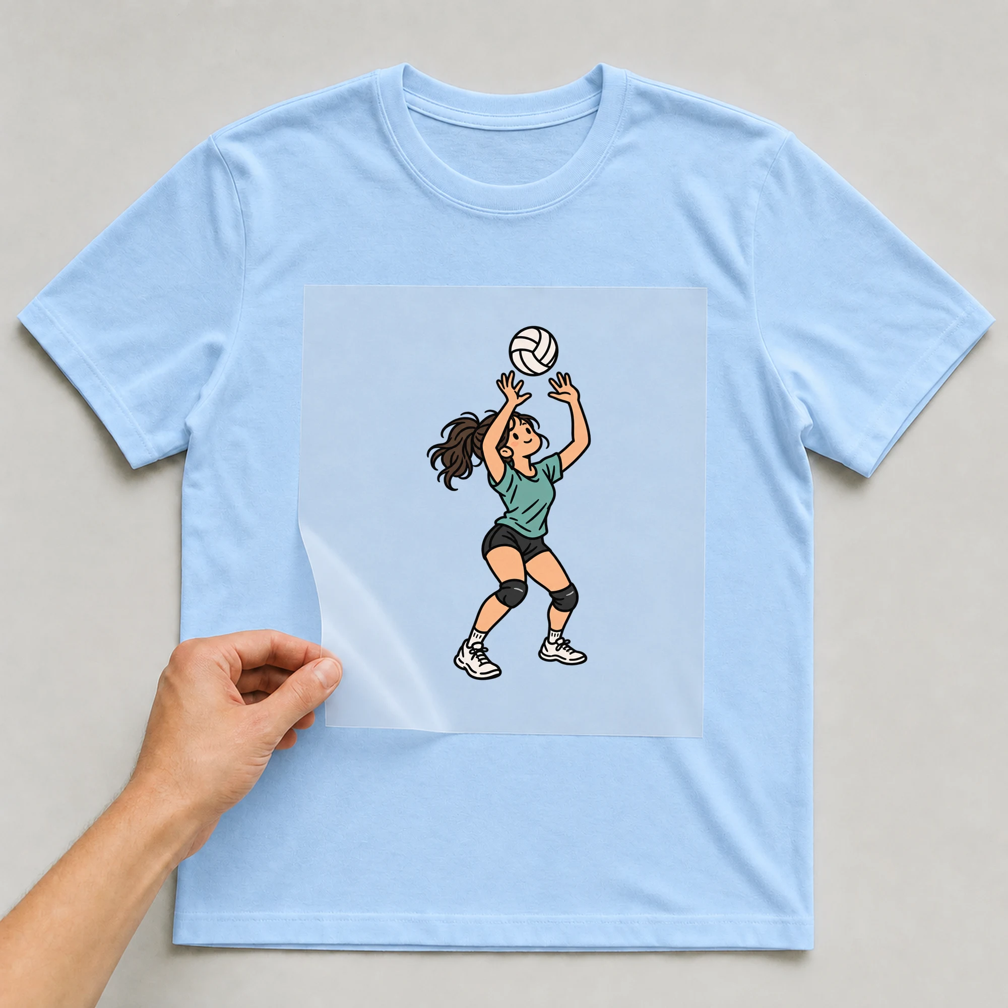Bügelbild „Volleyball Retro Woman“ auf babyblauem T-Shirt, Folie wird aufgelegt