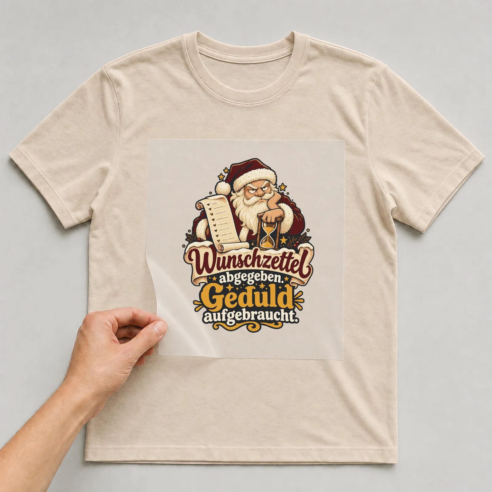 Bügelbild Wunschzettel abgegeben. Geduld aufgebraucht. auf beigem T-Shirt, Folie wird aufgelegt
