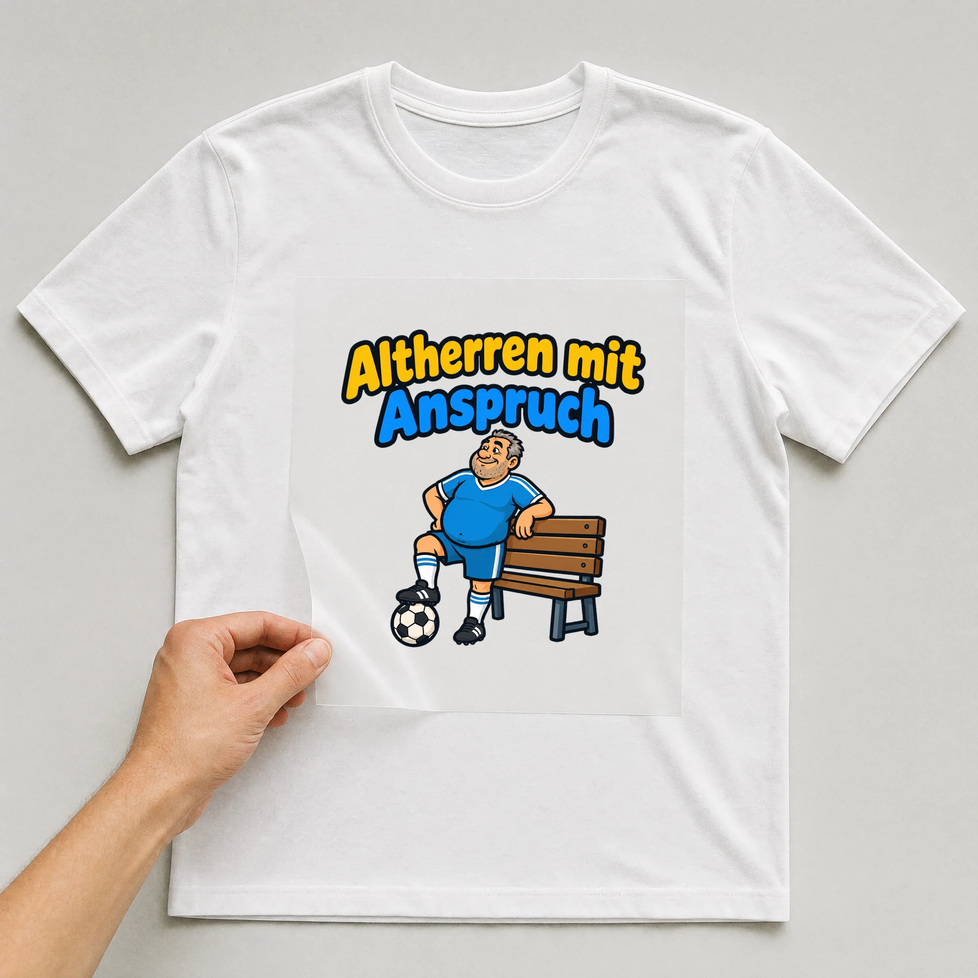 Bügelbild „Altherren mit Anspruch“ auf weißem T-Shirt, Folie wird aufgelegt
