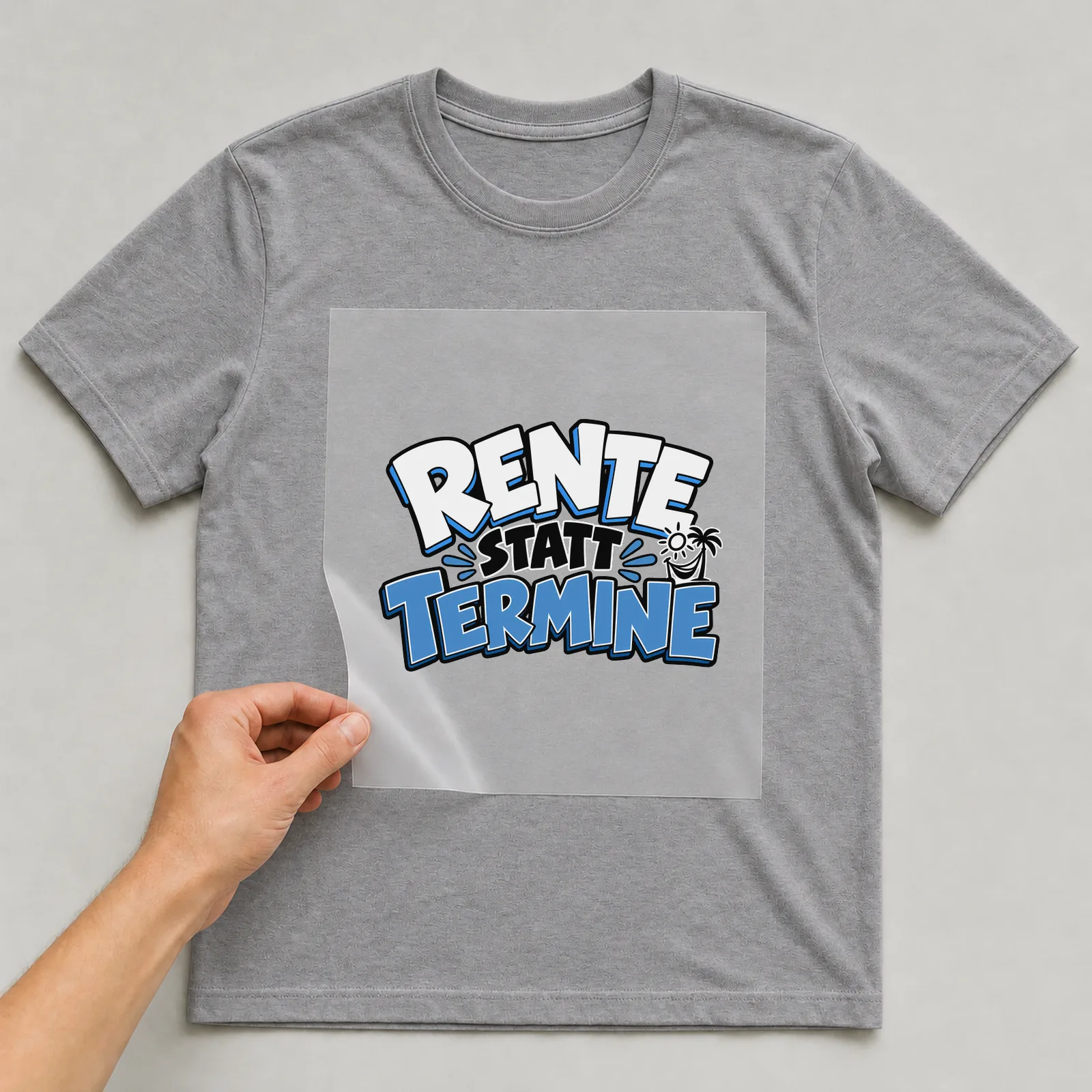 Bügelbild „Rente statt Termine“ auf grauem T-Shirt, Folie wird aufgelegt