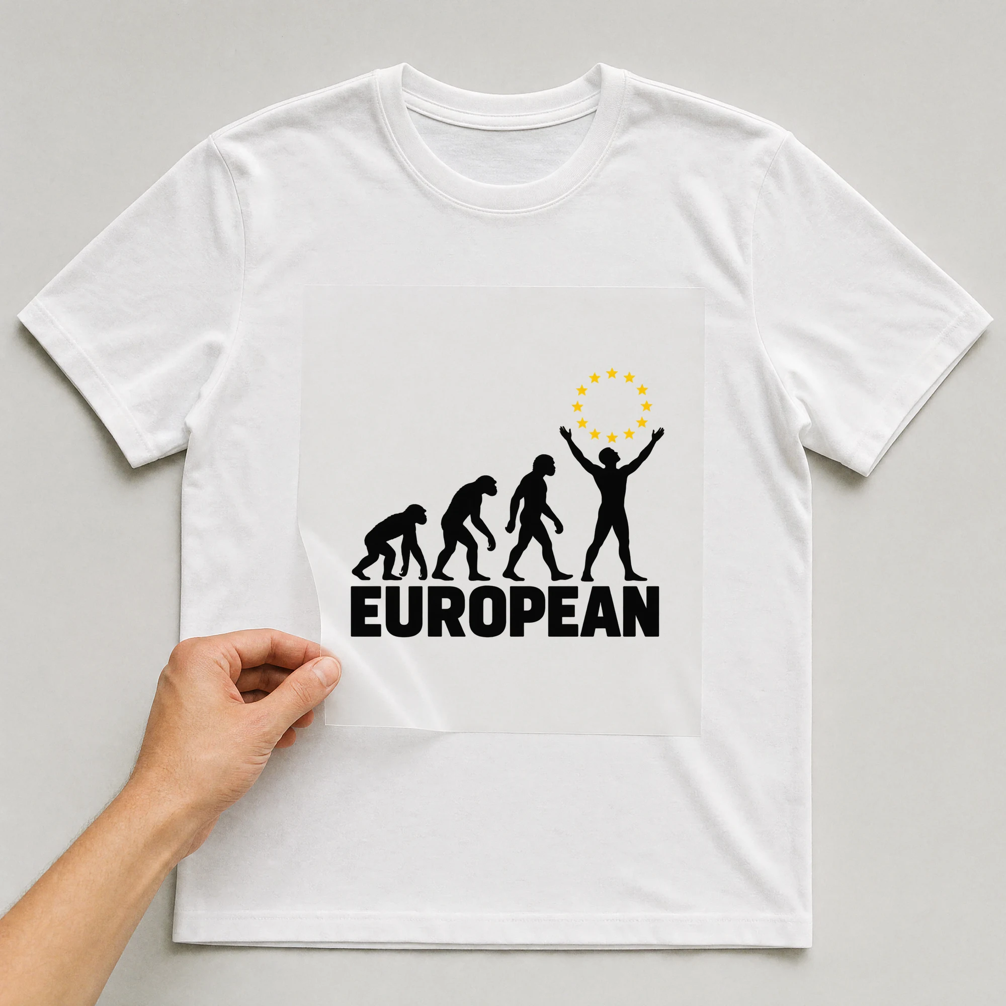 Bügelbild „European“ auf weißem T-Shirt, Folie wird aufgelegt
