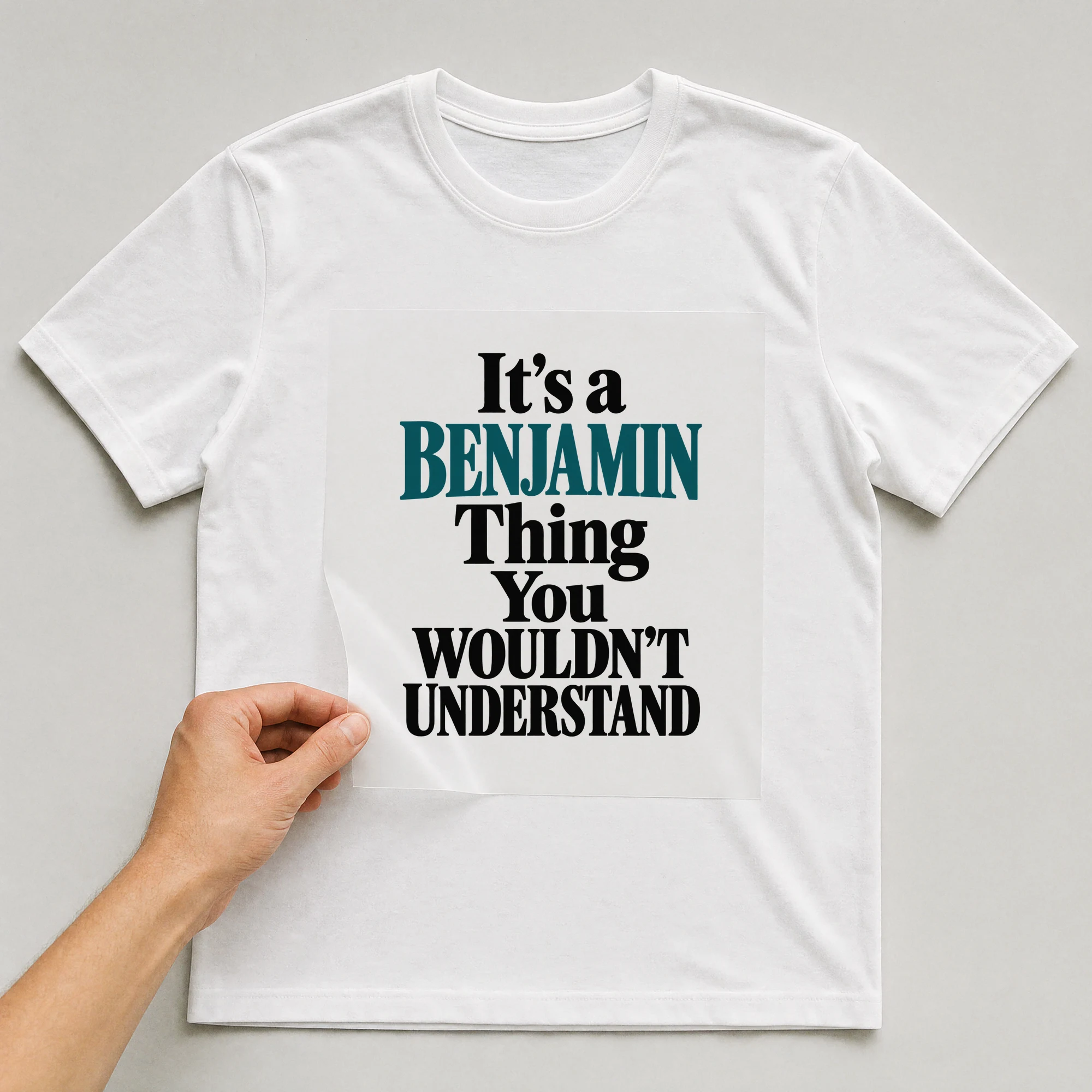 Bügelbild „It's a BENJAMIN Thing You WOULDN'T UNDERSTAND“ auf weißem T-Shirt, Folie wird aufgelegt