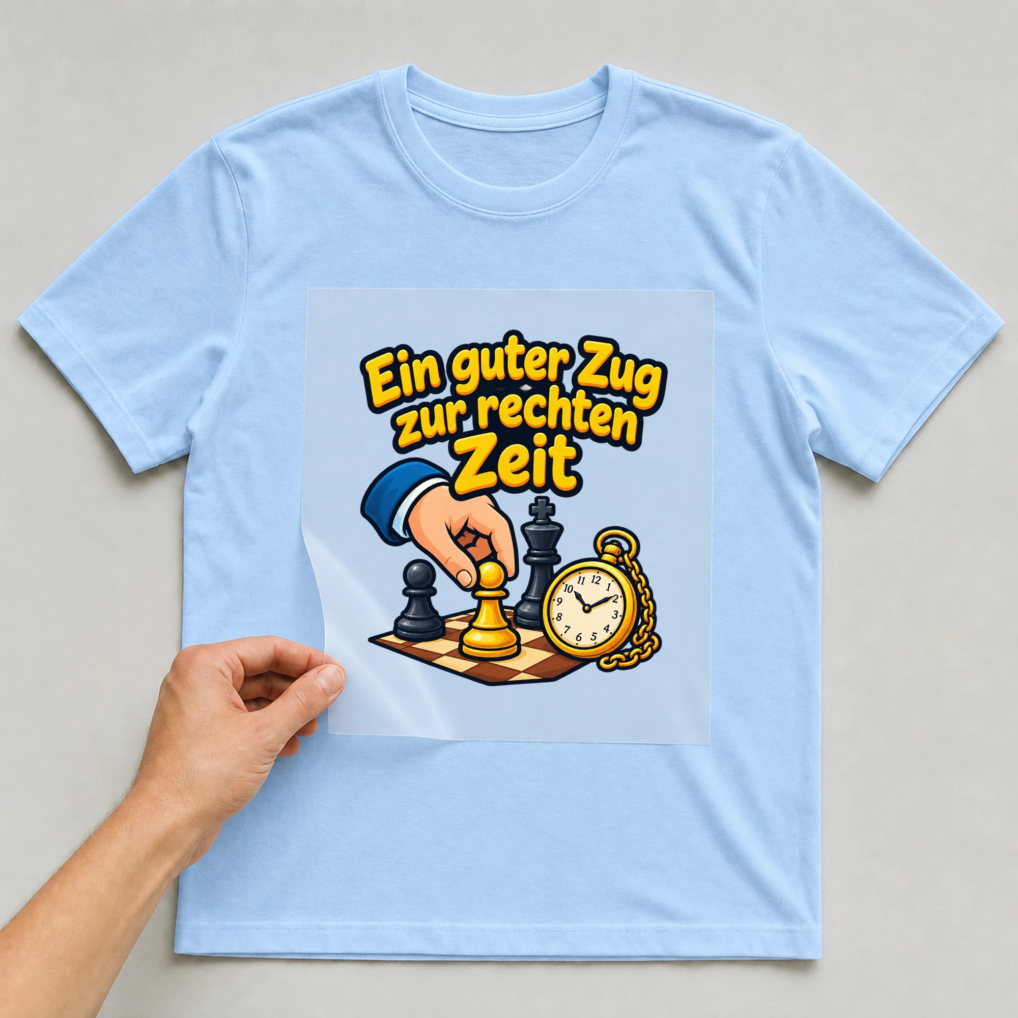 Bügelbild „Ein guter Zug zur rechten Zeit“ auf babyblauem T-Shirt, Folie wird aufgelegt