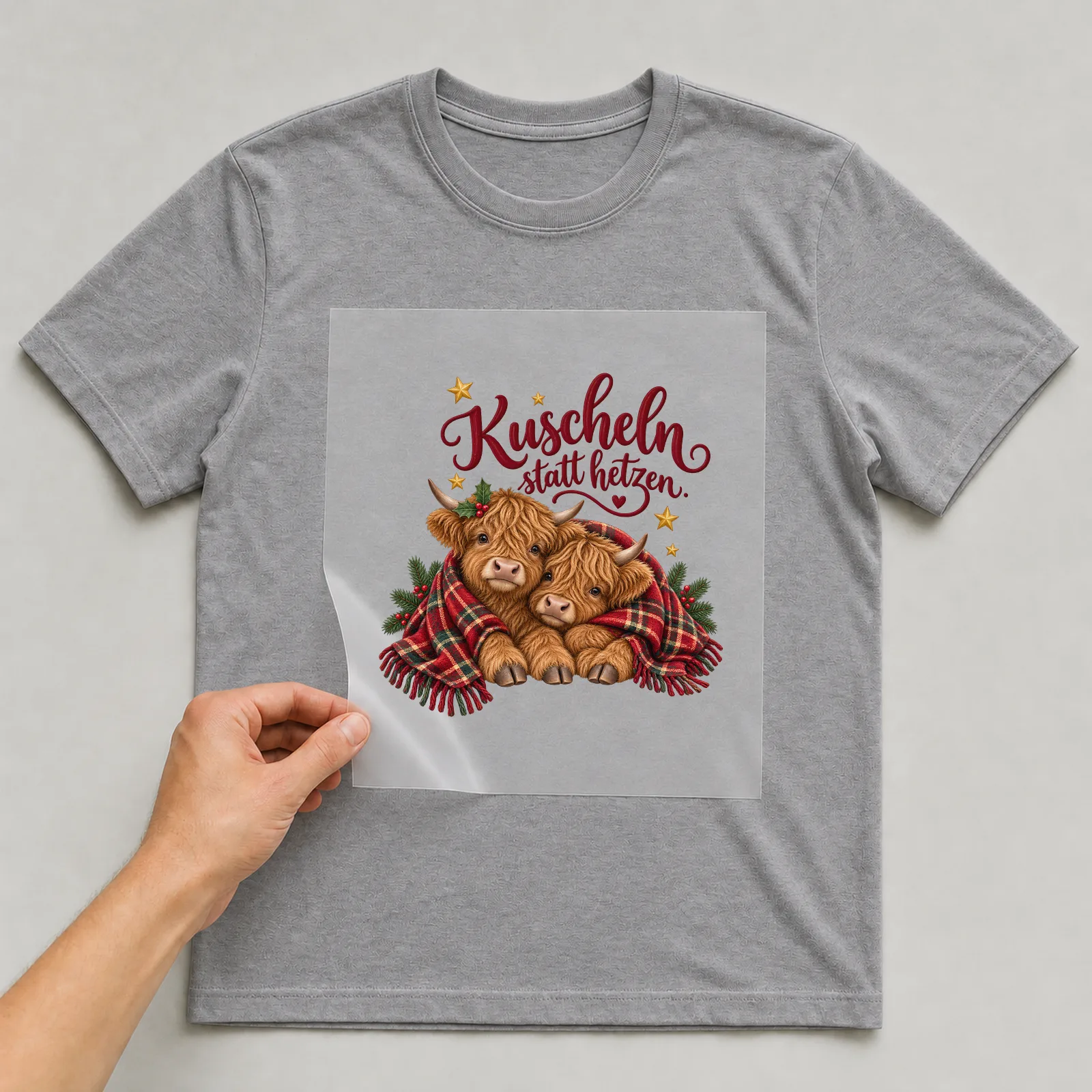 Bügelbild Kuscheln statt hetzen. auf grauem T-Shirt, Folie wird aufgelegt