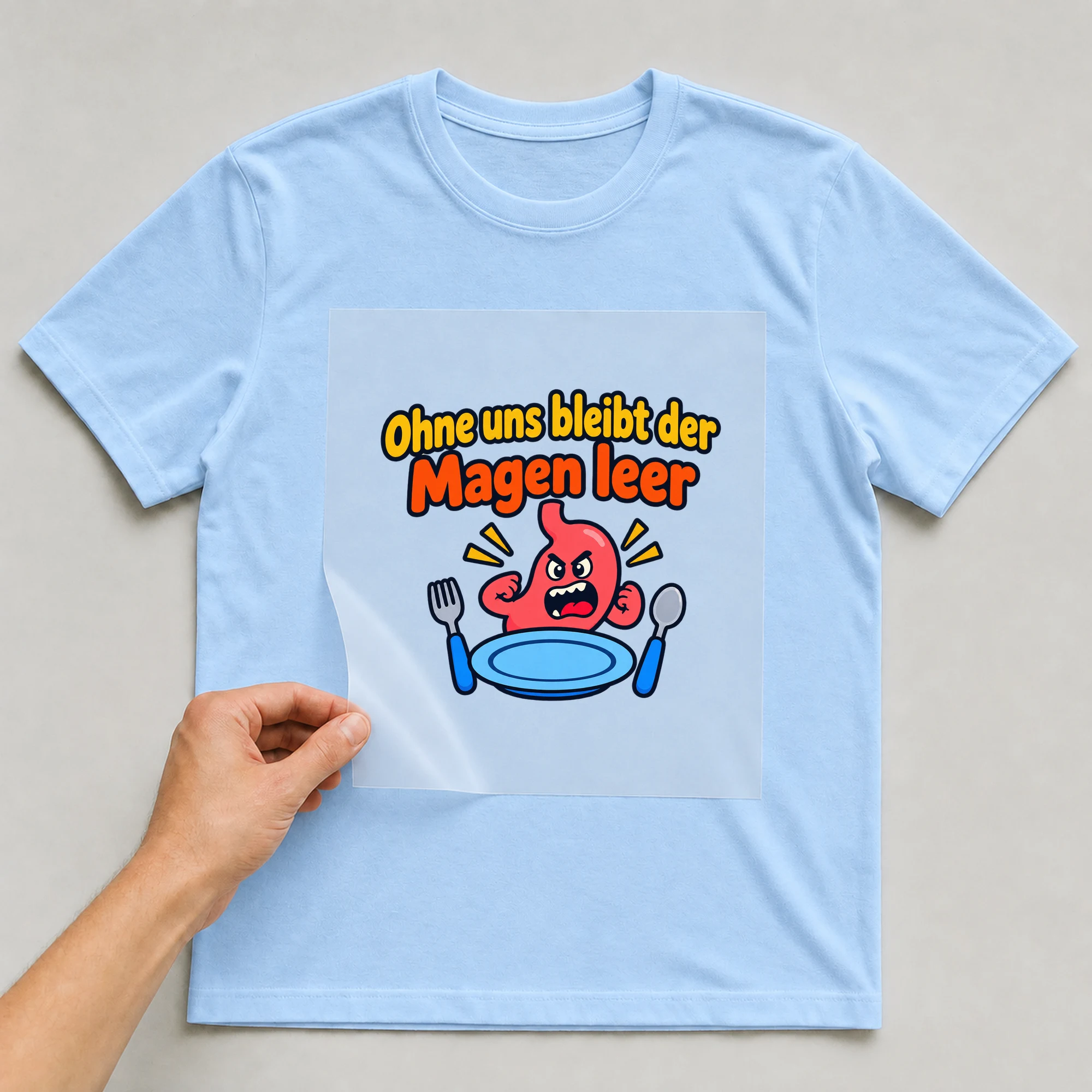 Bügelbild „Ohne uns bleibt der Magen leer“ auf babyblauem T-Shirt, Folie wird aufgelegt