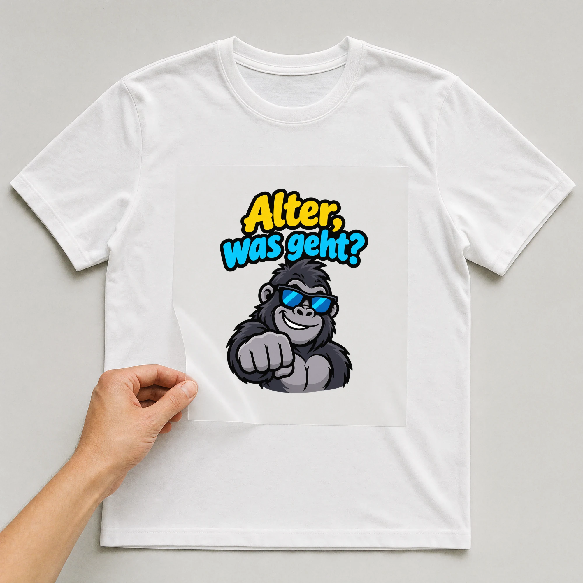 Bügelbild „Alter, was geht?“ auf weißem T-Shirt, Folie wird aufgelegt