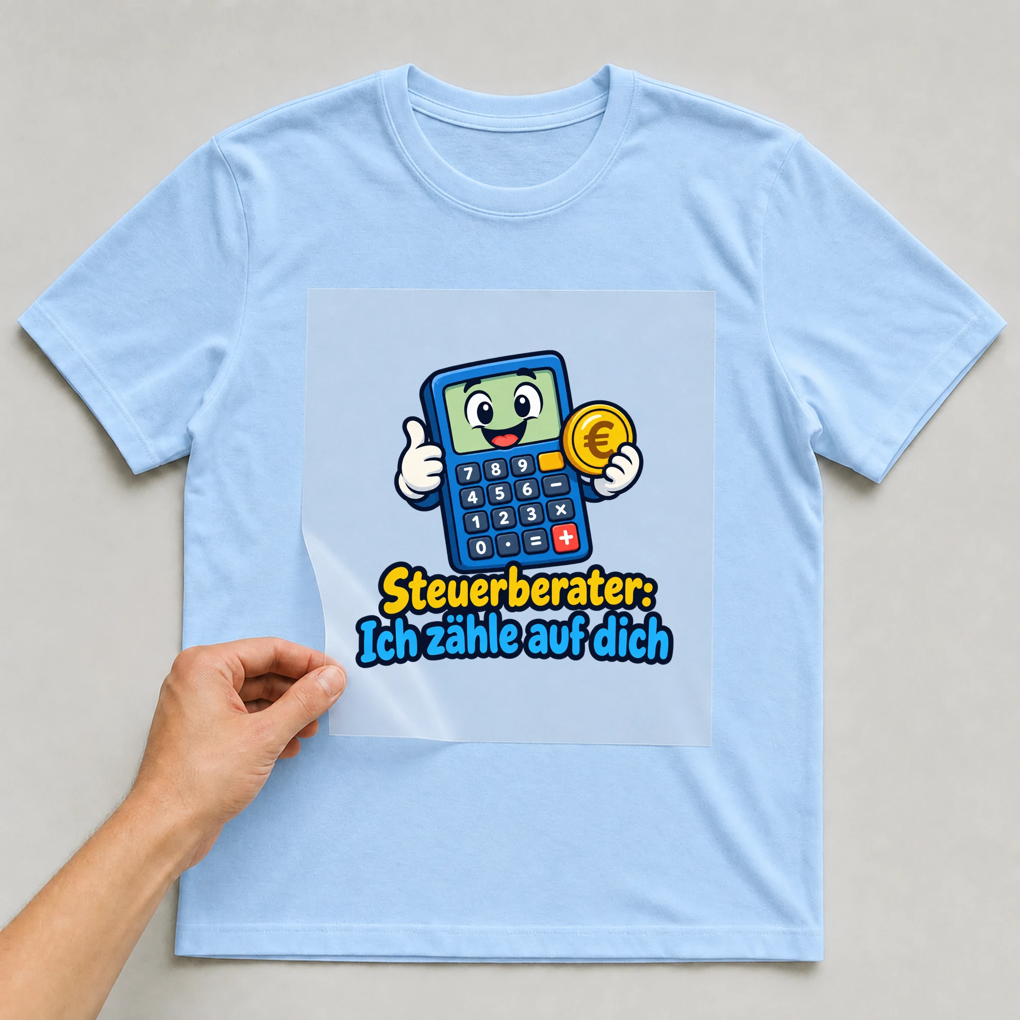 Bügelbild „Steuerberater: Ich zähle auf dich“ auf babyblauem T-Shirt, Folie wird aufgelegt