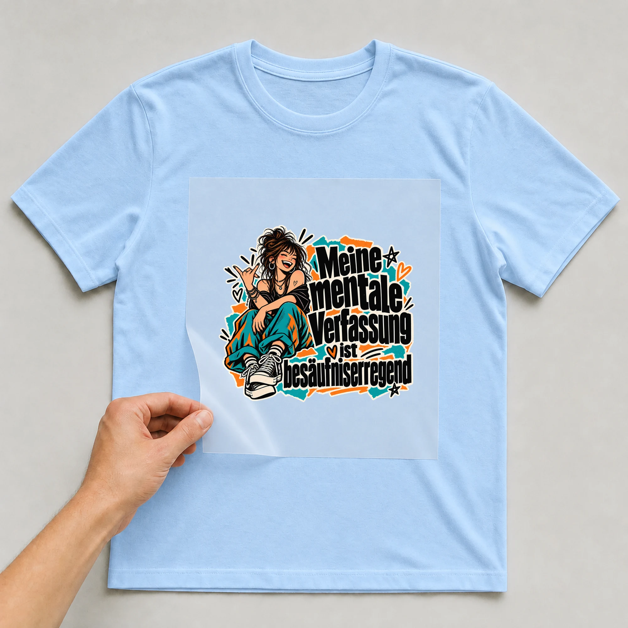 Bügelbild „Meine mentale Verfassung ist besäufniserregend“ auf babyblauem T-Shirt, Folie wird aufgelegt