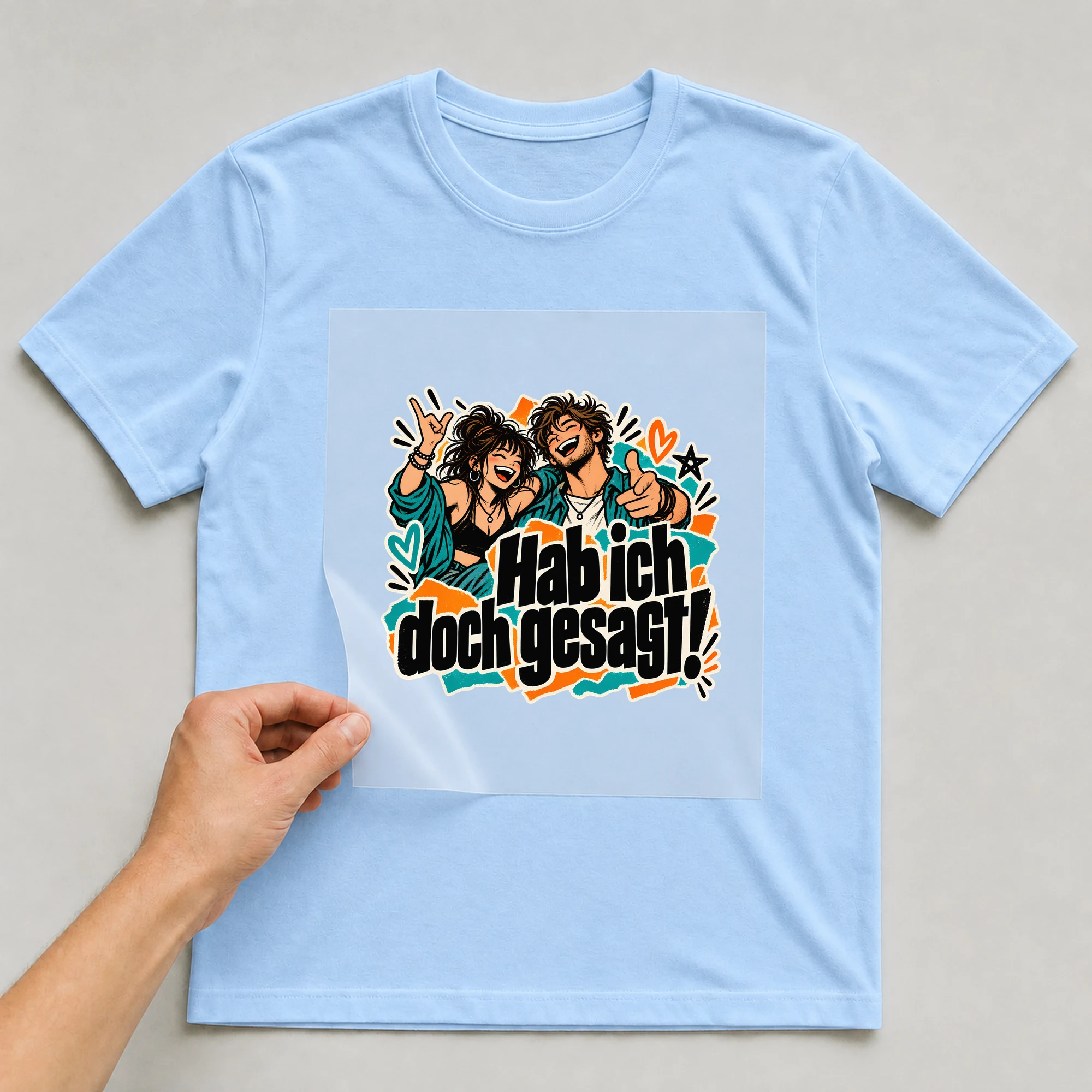 Bügelbild „Hab ich doch gesagt!“ auf babyblauem T-Shirt, Folie wird aufgelegt