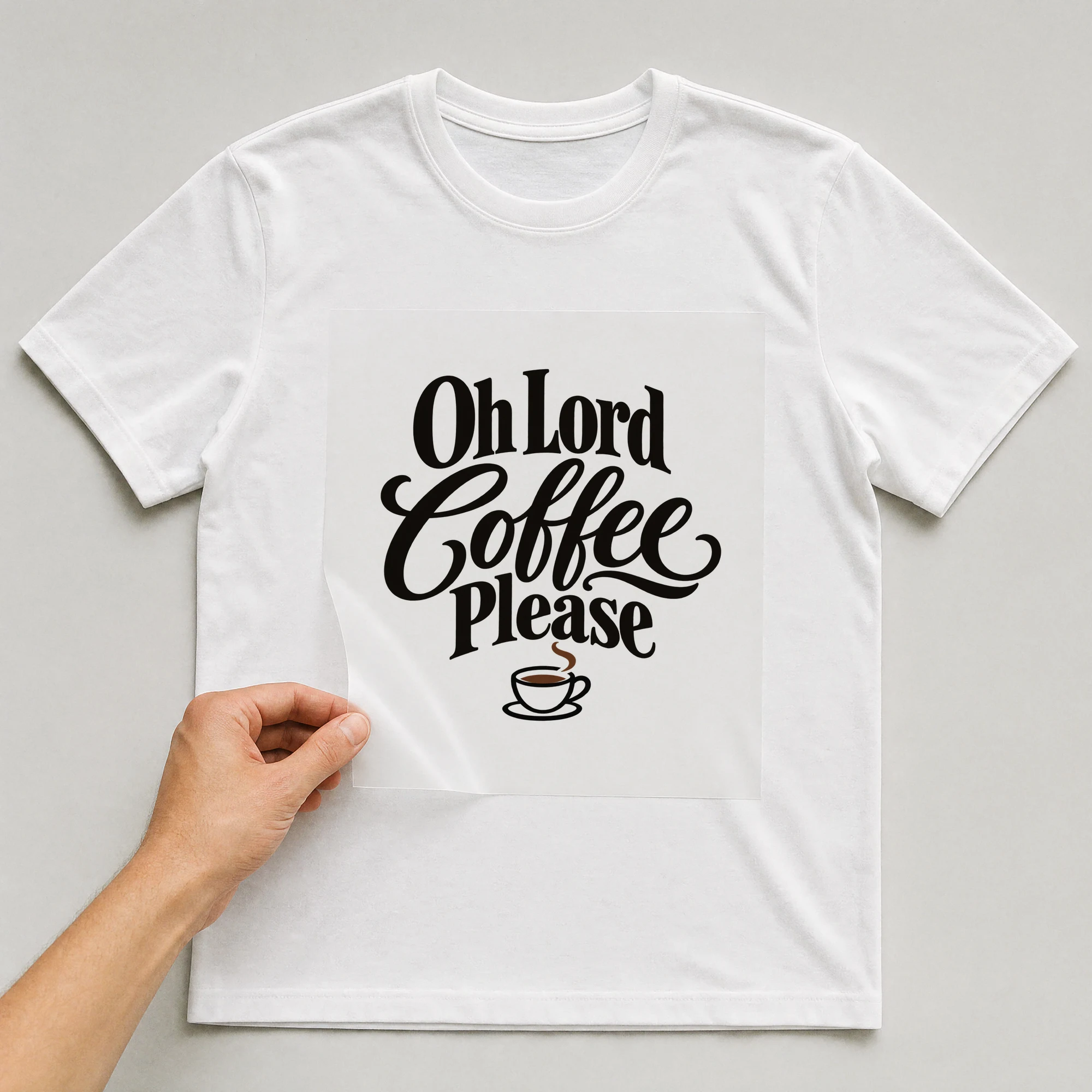 Bügelbild „Oh Lord Coffee Please“ auf weißem T-Shirt, Folie wird aufgelegt