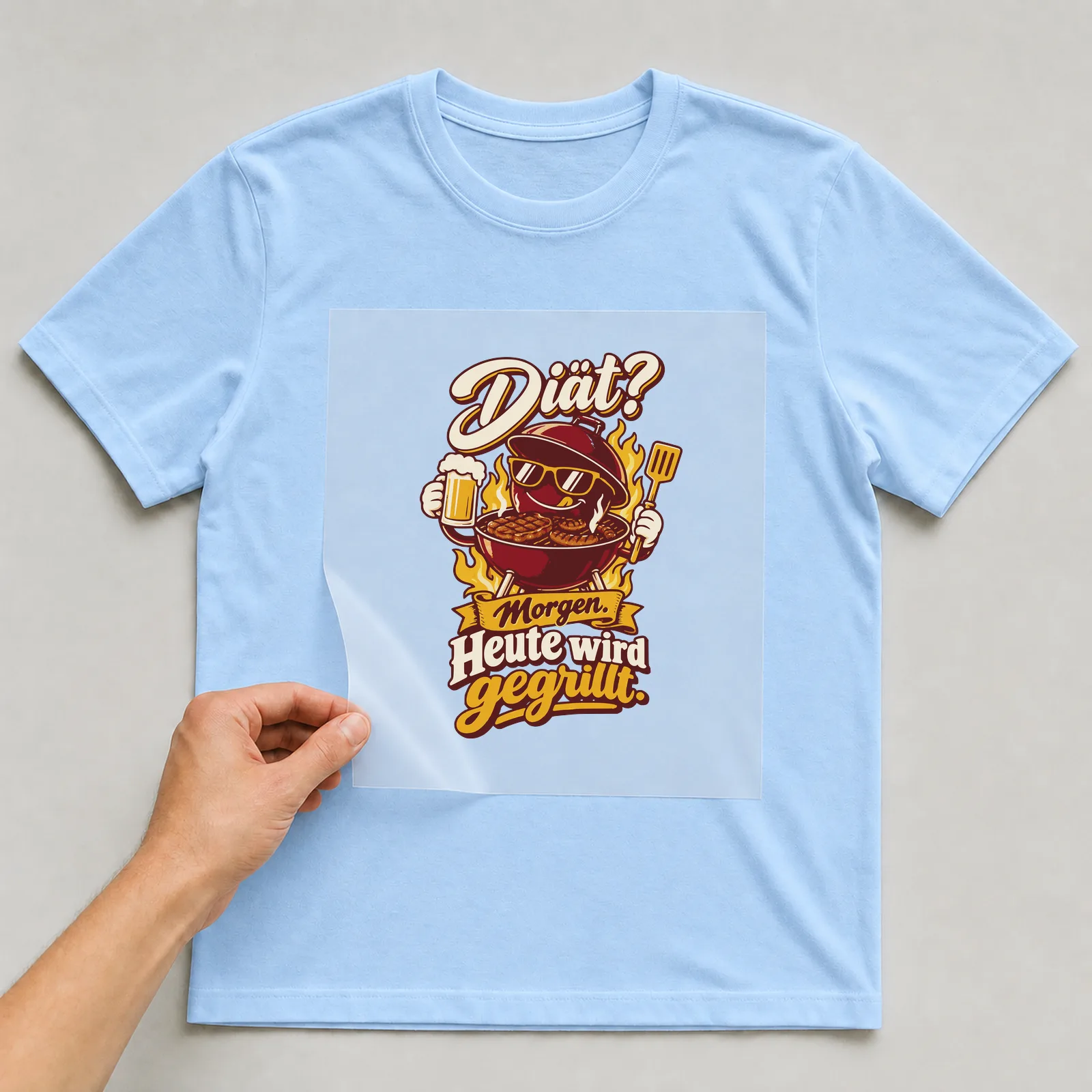 Bügelbild Diät? Morgen. Heute wird gegrillt. auf hellblauem T-Shirt, Folie wird aufgelegt