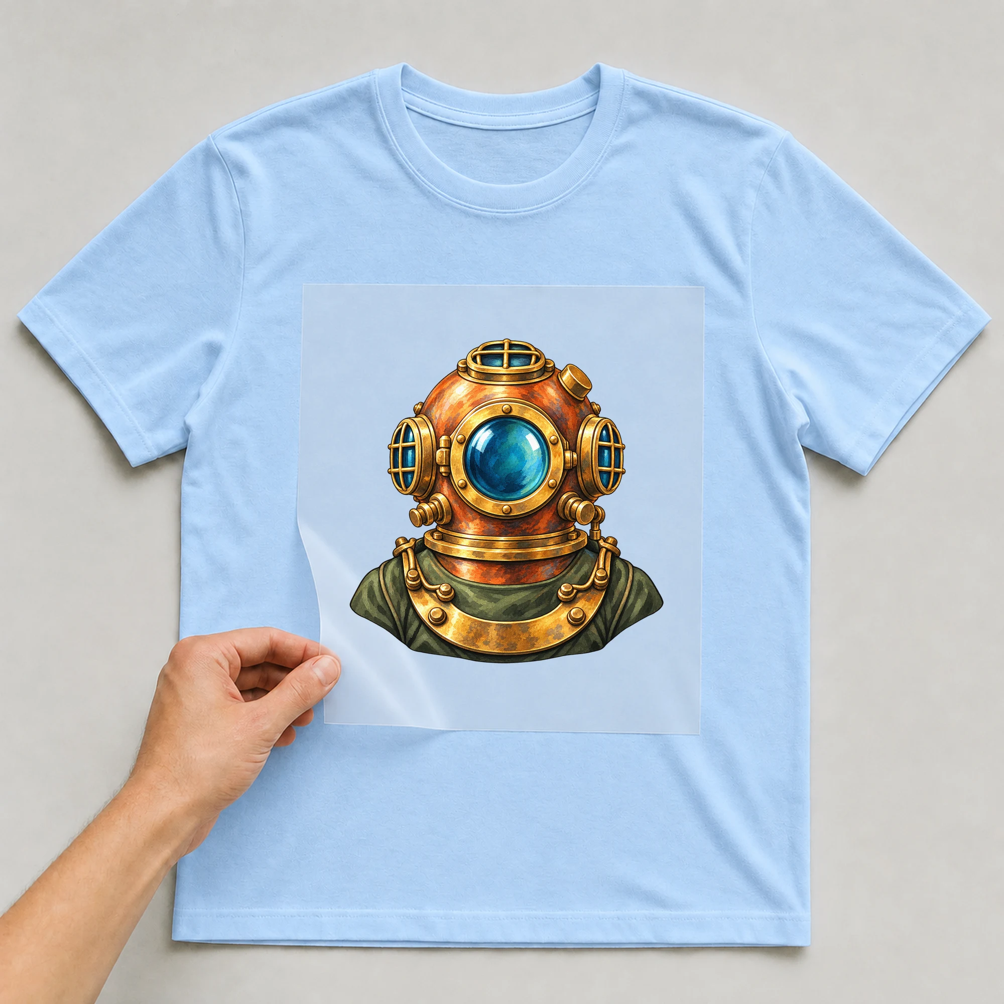 Bügelbild „Diver Soldier“ auf babyblauem T-Shirt, Folie wird aufgelegt