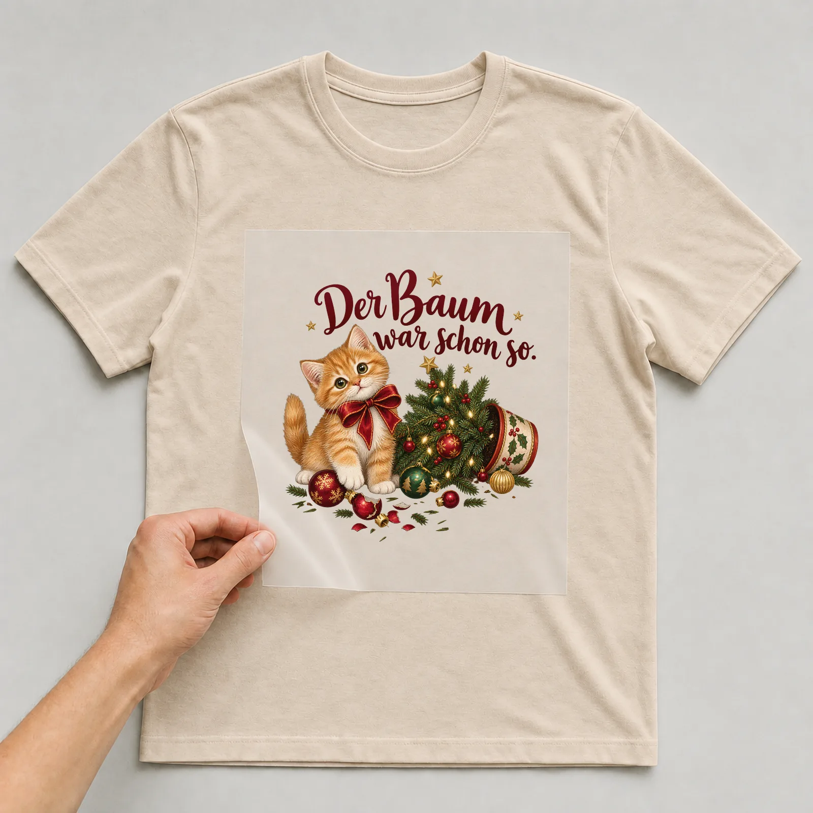 Bügelbild Der Baum war schon so. auf beigem T-Shirt, Folie wird aufgelegt