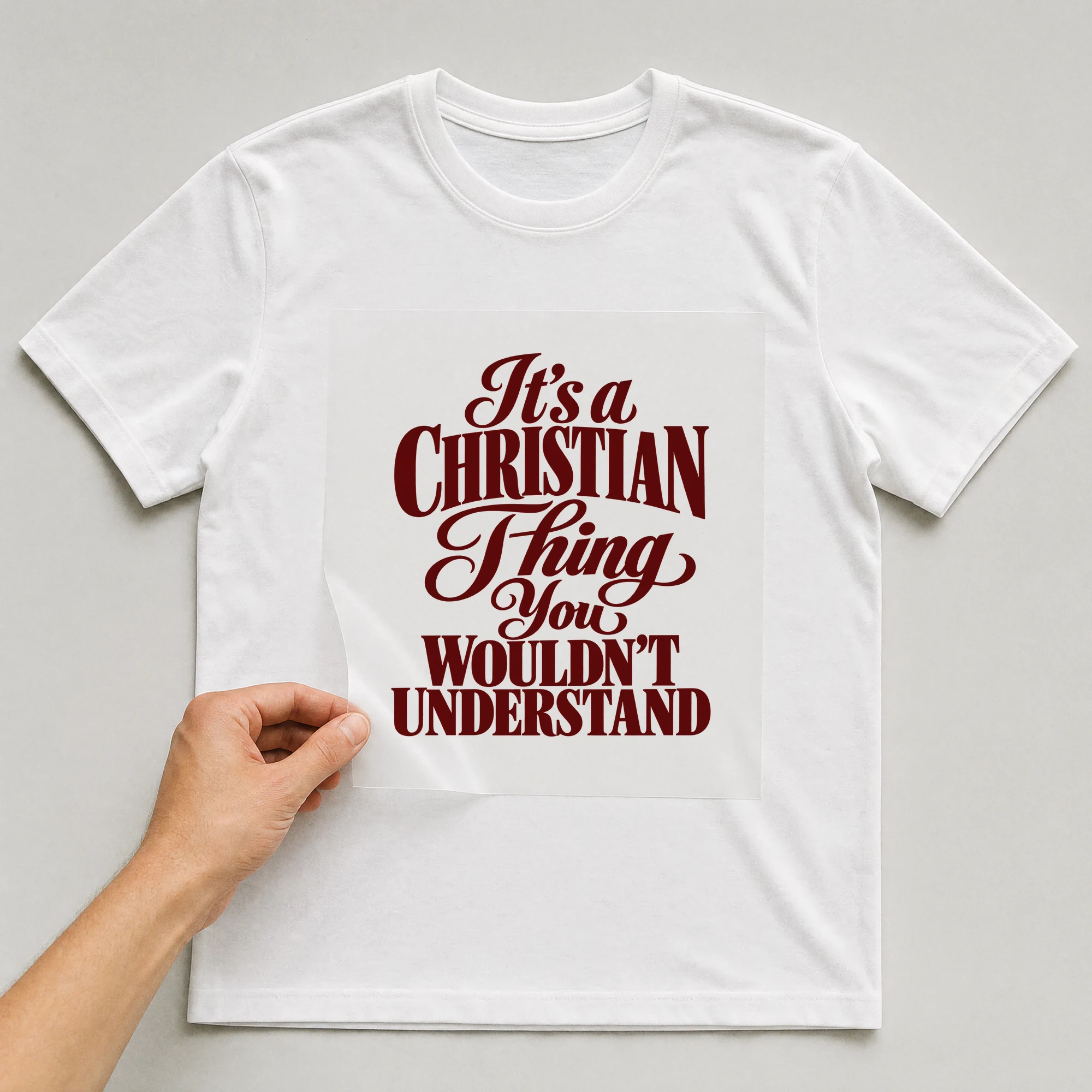 Bügelbild „It's a CHRISTIAN Thing You WOULDN'T UNDERSTAND“ auf weißem T-Shirt, Folie wird aufgelegt